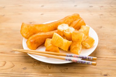 Fried bread stick or popularly known as You Tiao, a popular Chinese cuisine clipart