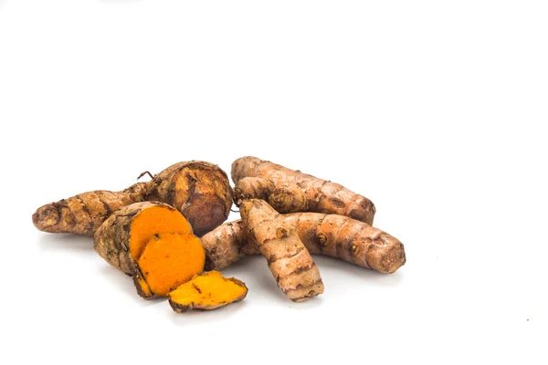 Fresh turmeric roots with healing properties on white background — 图库照片