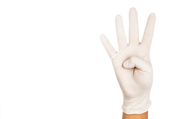 Hand in surgical latex glove gesture number Four — Stock Photo, Image