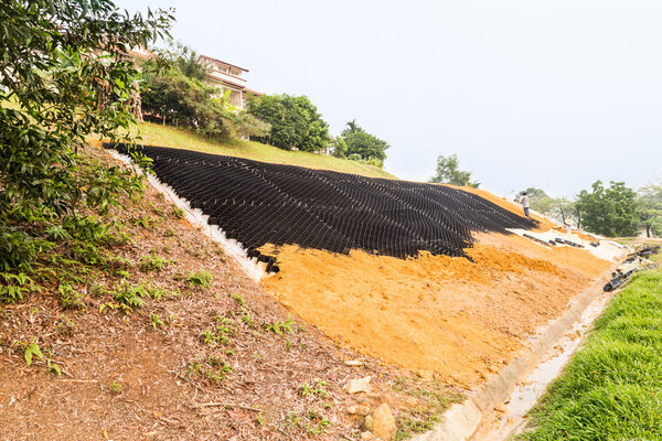 Slope erosion control with grids and earth on steep slope