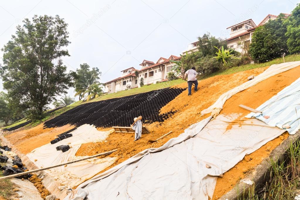 Slope erosion control with grids and earth on steep slope