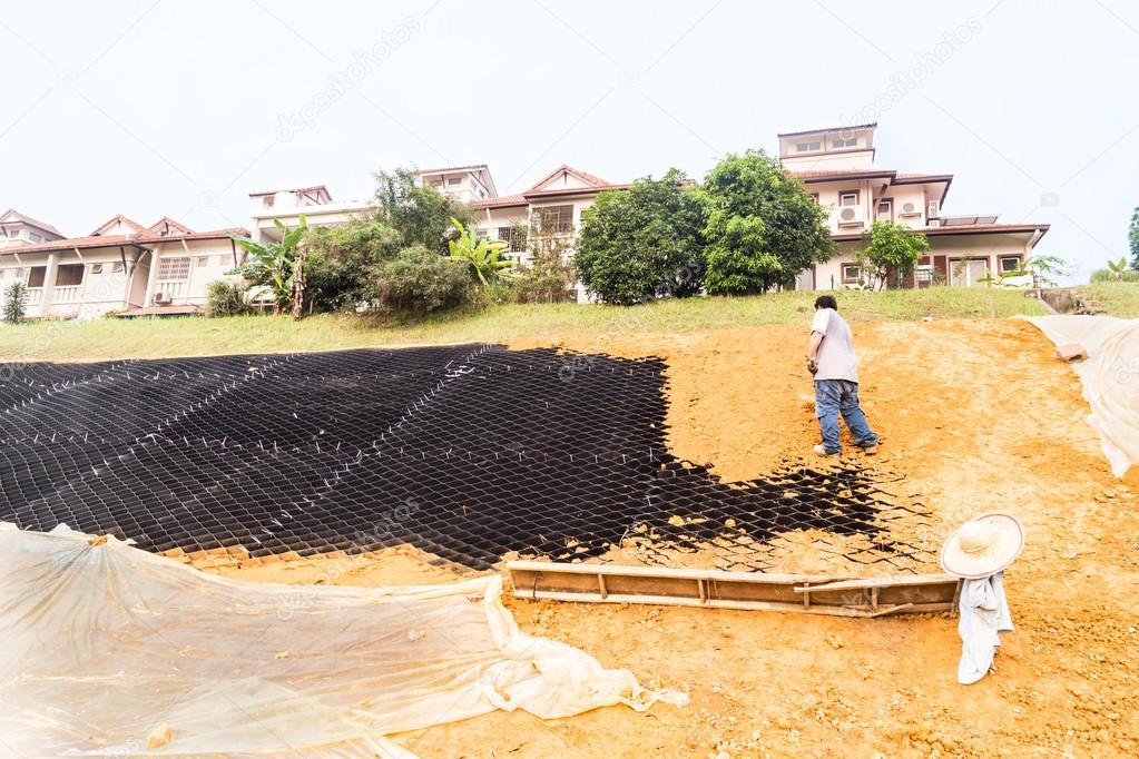 Slope erosion control with grids and earth on steep slope