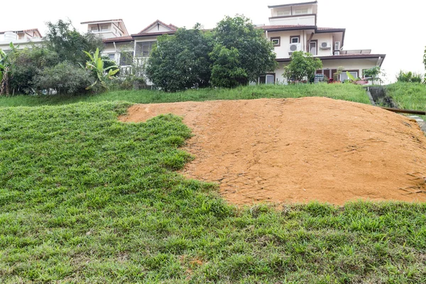 Slope erosion with grids and grass planted on steep slope — Stock Photo, Image