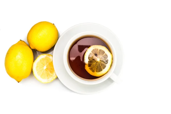 Overhead shot of refreshing hot tea with lemon slice on white background — Stok Foto