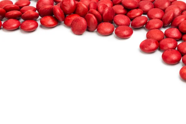 Övre högra ram av röda choklad godis på vit bakgrund — Stockfoto