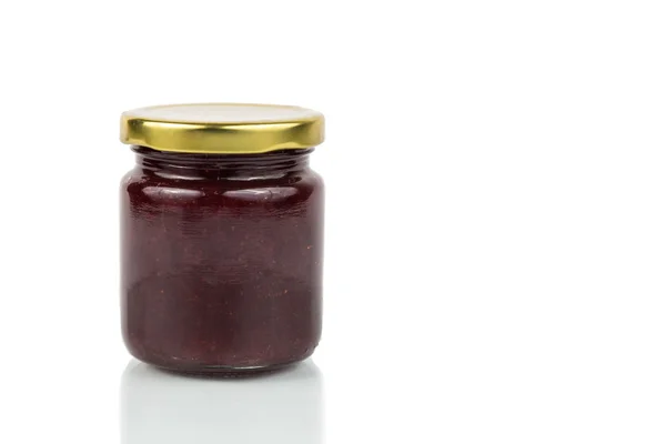 Organic strawberry jam in transparent glass jar — Stock Fotó