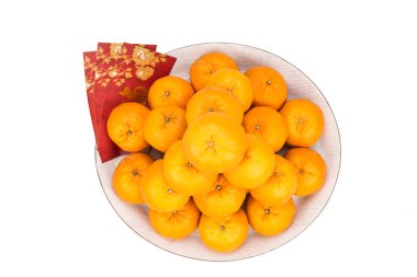 Heap of mandarin oranges, red packets with good luck character