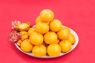 Mandarin oranges, gold nuggets, red packets, Chinese good luck w