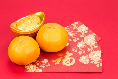 Mandarin oranges, gold nuggets, red packets, Chinese good luck c