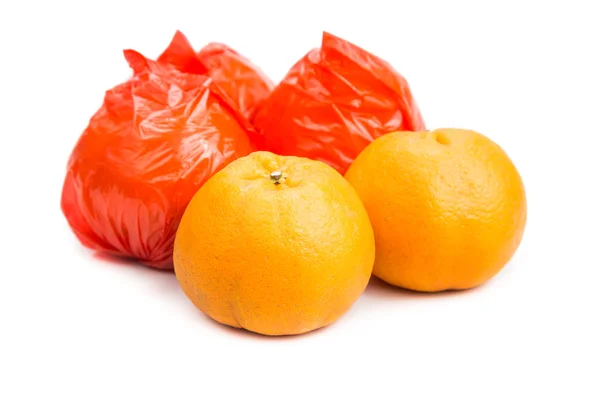 Mandarin oranges with plastic protective wrapper isolated in whi — стокове фото