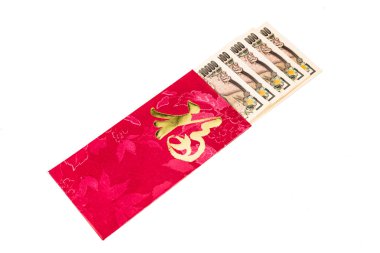 Red packet with Good Fortune character contains Japanese Yen currency