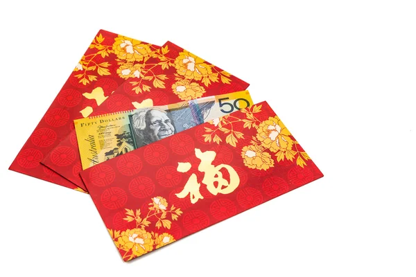 Paquete rojo con carácter de buena fortuna contiene dólar australiano —  Fotos de Stock