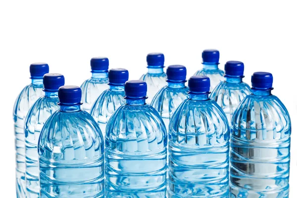 Closeup on rows of mineral water in plastic bottle — Stock Photo, Image