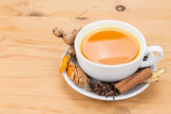 Healthy turmeric tea with black pepper, cinnamon, cloves and ginger — Stock Fotó