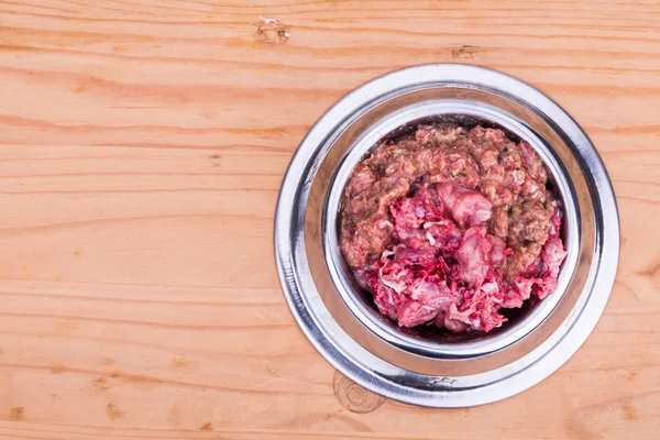 Fresh and nutritious minced raw meat dog food in bowl — Stock Photo, Image