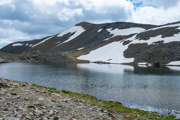 stock image Lonely Laghetto di Fedaria - a hidden alpine lake at the Swiss - Italian border