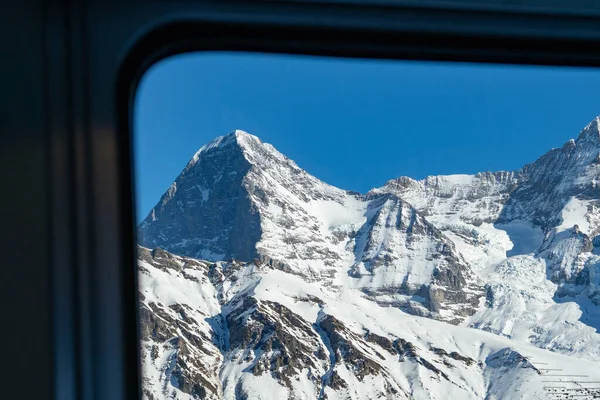 View out of the window of Muerren train to the famous mountain Eiger — Stock Photo, Image