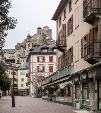 Sion, Switzerland - March 13th 2021: Urban street in the historic city centre.