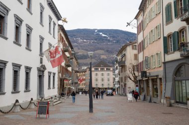 Sion, Switzerland - March 13th 2021: Urban street in the historic city centre.