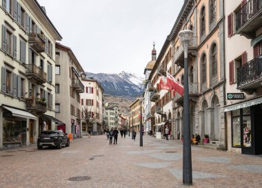 Sion, Switzerland - March 13th 2021: Urban street in the historic city centre.