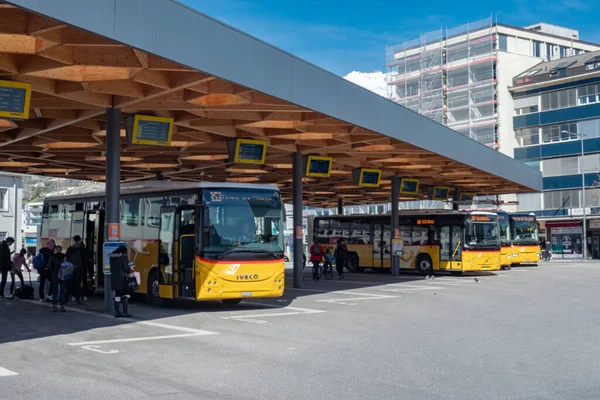 Sion, Switzerland - March 13th 2021: Central bus terminal with postal cars — Stockfoto