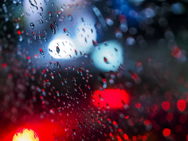 Abstracte beelden regen druppels op de spiegel in de nacht — Stockfoto