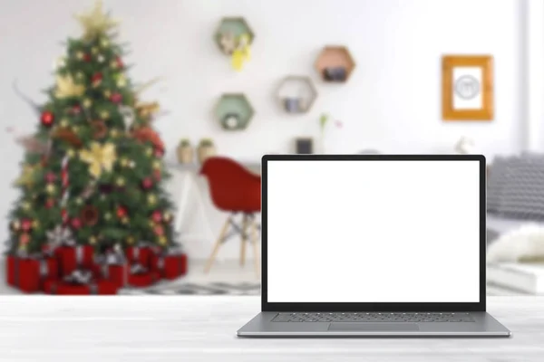冬の販売 休日のオンラインショッピング 空のディスプレイ画面ラップトップコンピュータ クリスマスの装飾が施されたモダンな居心地の良い家庭のリビングルーム ホームオフィスのデスクワークスペース コピースペースをモックアップします オンラインストア 電子商取引 ストック画像