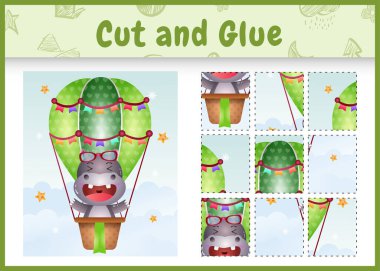 Children board game cut and glue with a cute hippo on hot air balloon