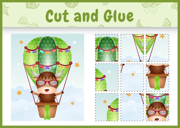 Çocukların masa oyunu, sıcak hava balonunda tatlı bir bufaloyla kes ve yapıştır.