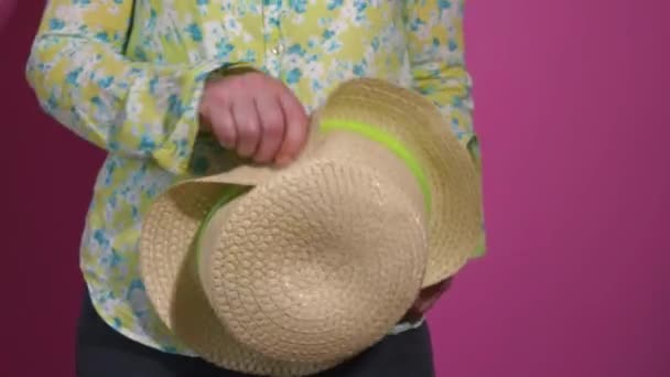 Goofy woman dancing with straw hat — Stockvideo
