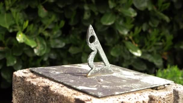 Sun dial in a summer garden — Stock Video