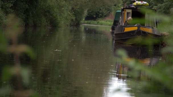 Barge on canal waterway in England on summer day — Video