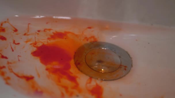 Blood in bathroom sink floats in water — Stock Video