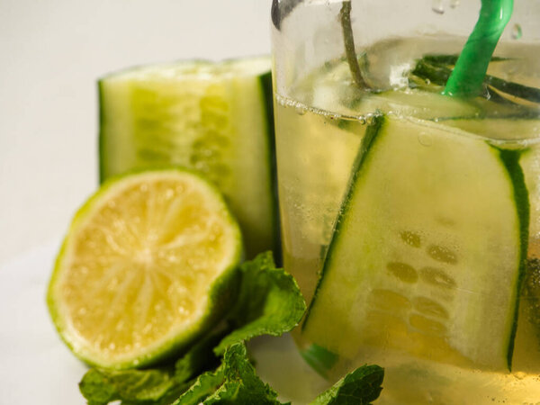 Healthy cucumber mint and lime refreshing detox drink close up shot selective shot