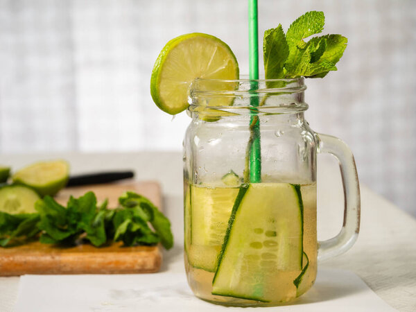 Healthy cucumber mint and lime refreshing detox drink medium shot selective shot