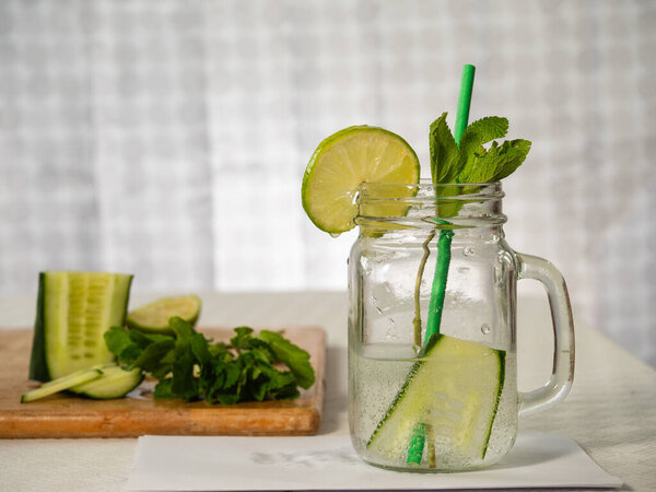 Healthy cucumber mint and lime refreshing detox drink medium shot selective shot