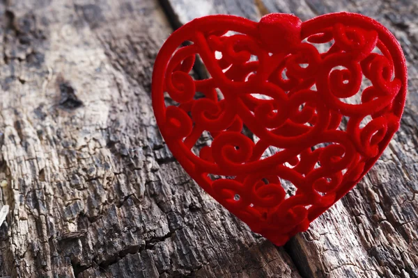 Red velvet heart on a wooden background closeup — Stock Photo, Image