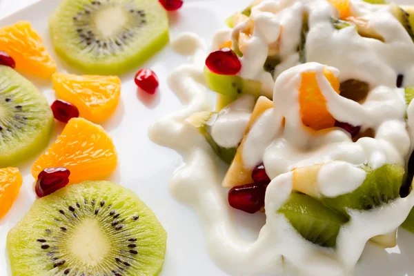Fruit and ice cream closeup on a white plate — Stock Photo, Image