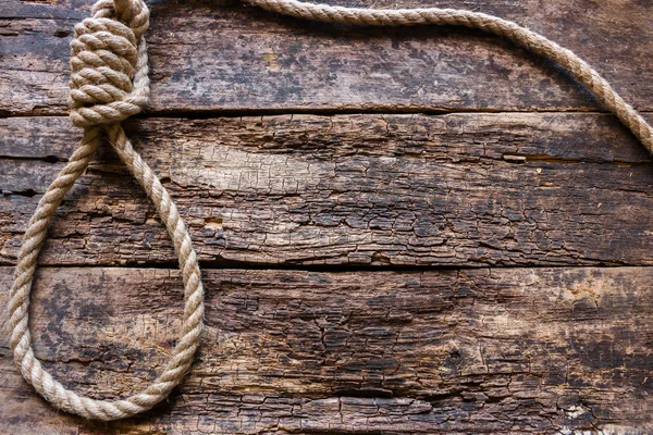 Kötelet, a slipknot, a fából készült háttér — Stock Fotó