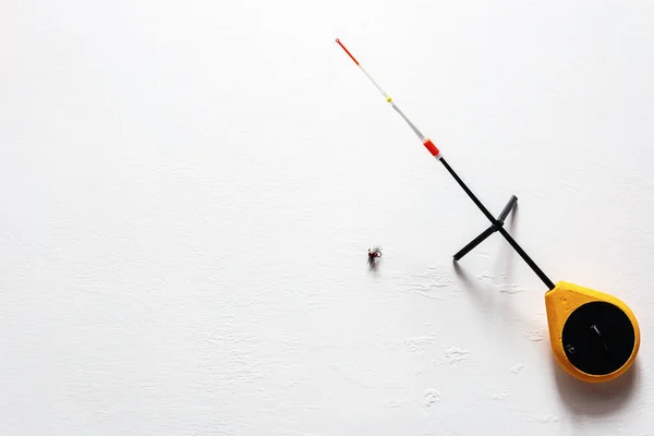 russian ice fishing rod balalaika on white background with place for text