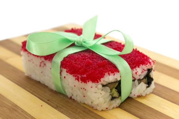 Rolls with a ribbon on a cutting board horizontal — Stock Photo, Image