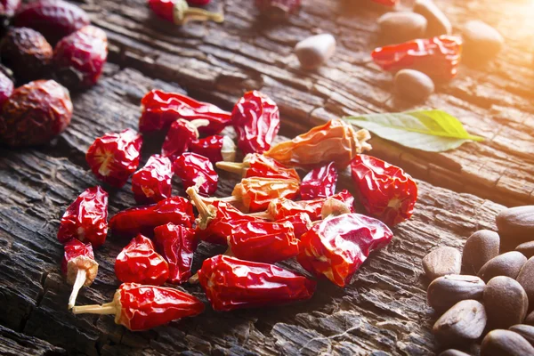 The heart of the dry red pepper closeup on wooden background selective focus — Stock Photo, Image