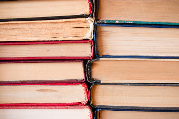 Stack of old books binding to each other