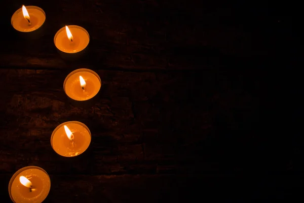 Semicircle of candles on a black background — Stock Photo, Image