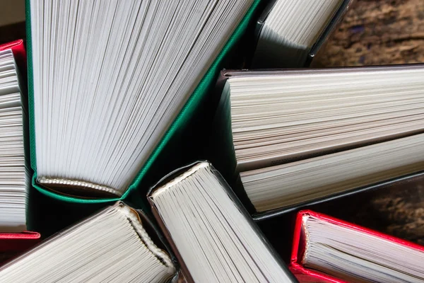 Hardcover books top view of a wooden background — Stock Photo, Image