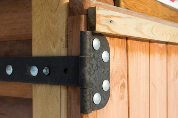 Door hinge on wooden door — Stock Photo, Image