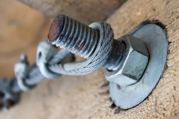 Metal anchoring wooden beams, bolt and nut — Stock Photo, Image