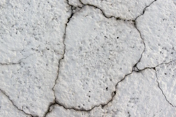 Pared gris hormigón con grietas de primer plano —  Fotos de Stock