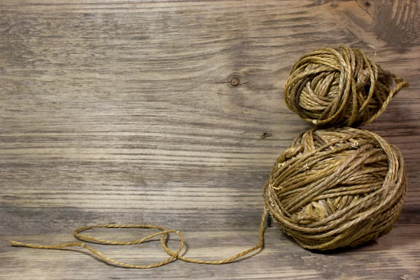 The coils of jute rope on wooden background. Free space for text. — Stock Photo, Image