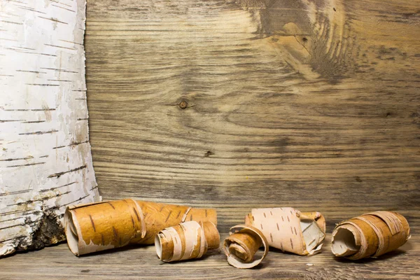 Rolls of birch Bark on wooden — Stock Photo, Image